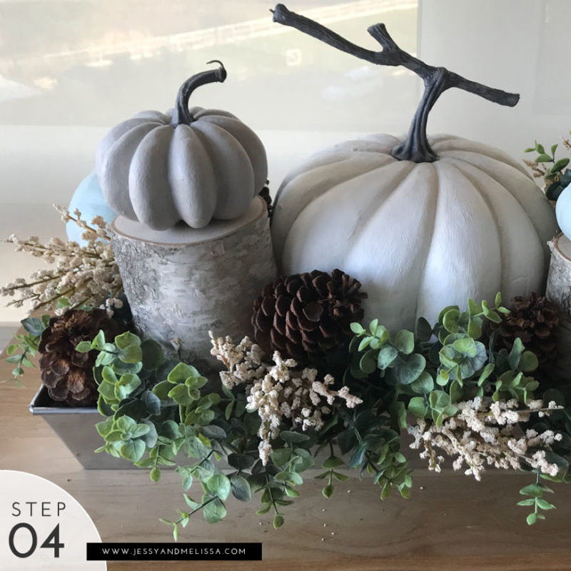 Step 4: Fill the emplty areas with the eucalyptus, berries and pinecones